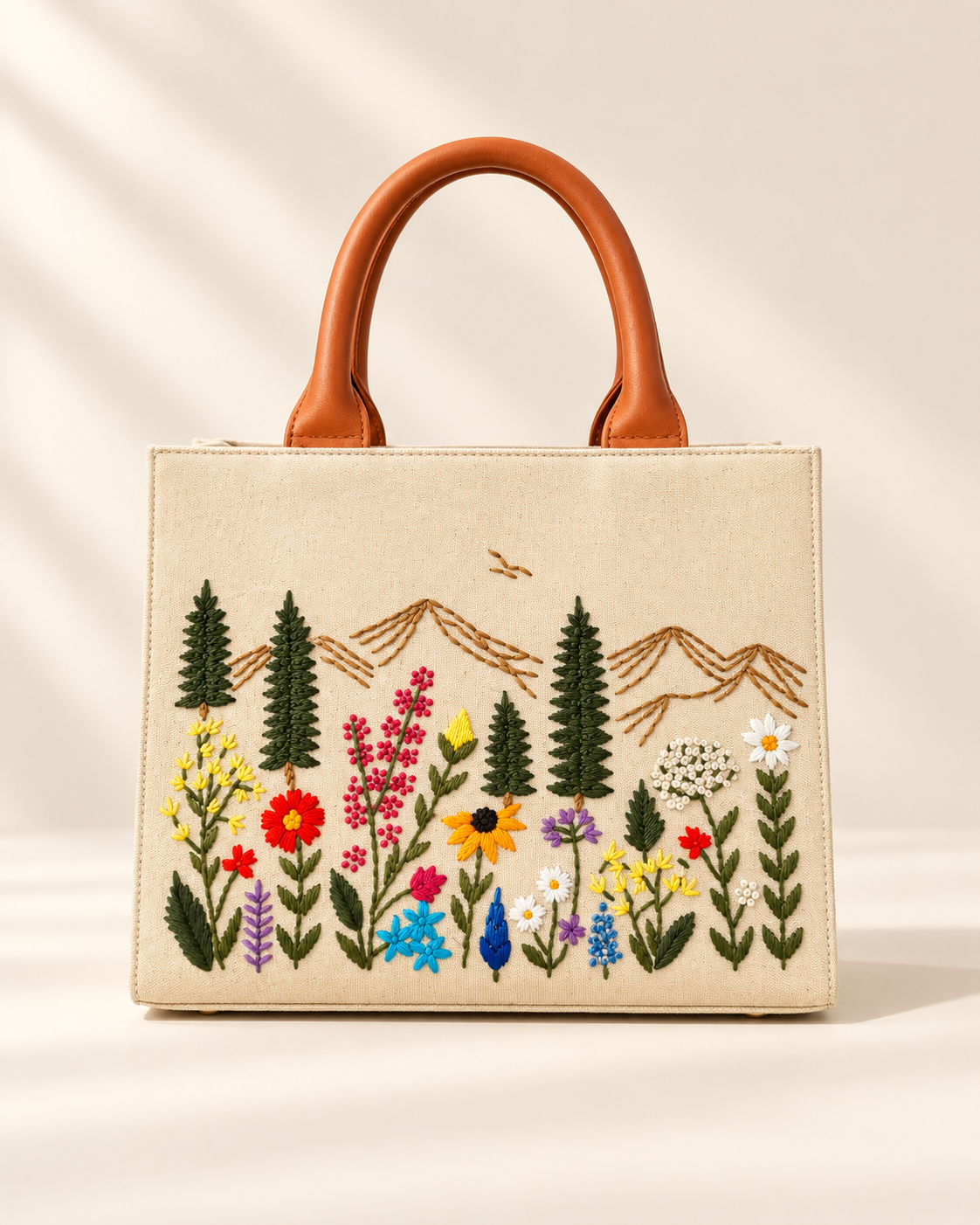 Natural · Medium Meadow Carryall handbag with hand-embroidered wildflowers and mountains, front view