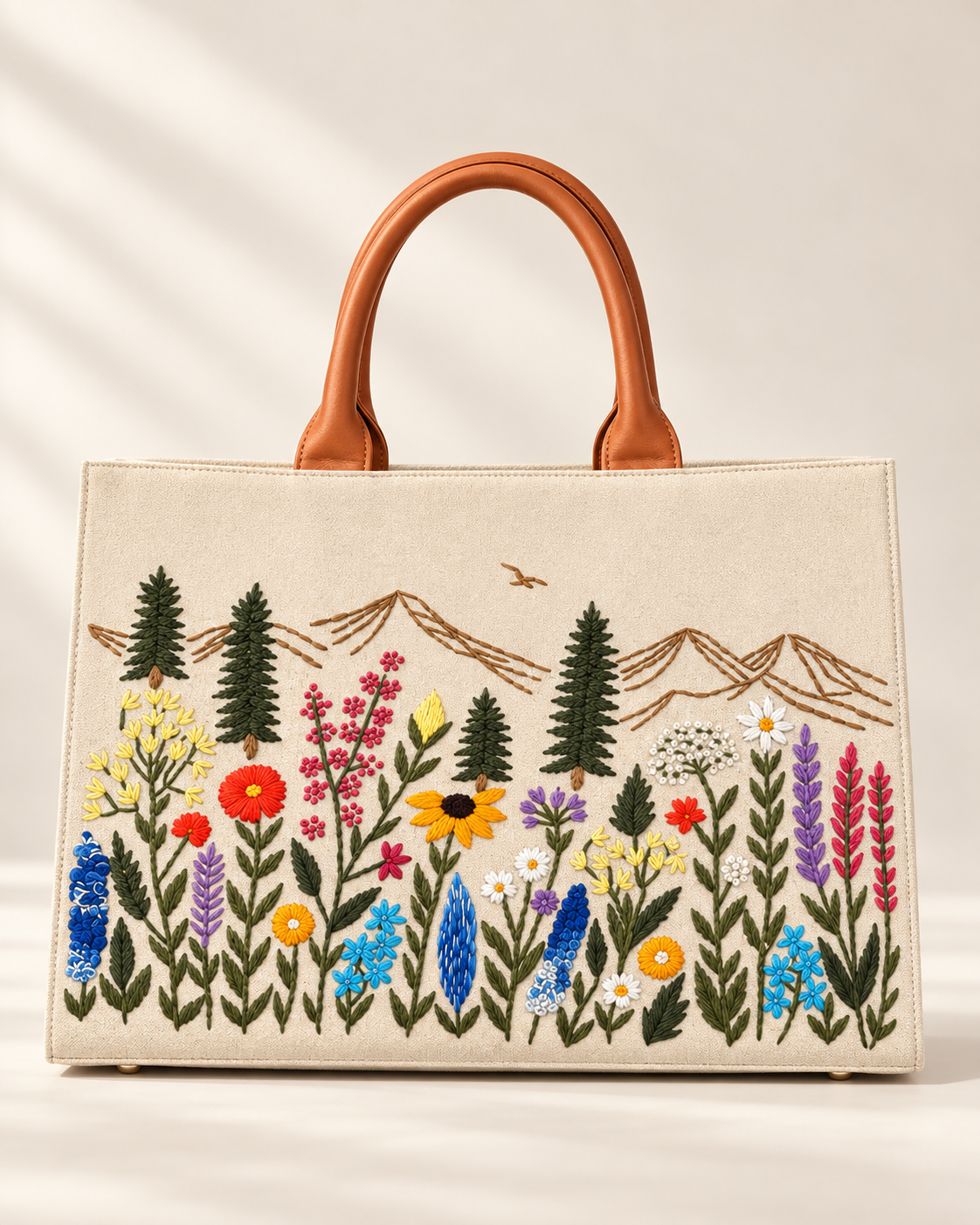 Natural · Large Meadow Carryall handbag with hand-embroidered wildflowers and mountains, front view