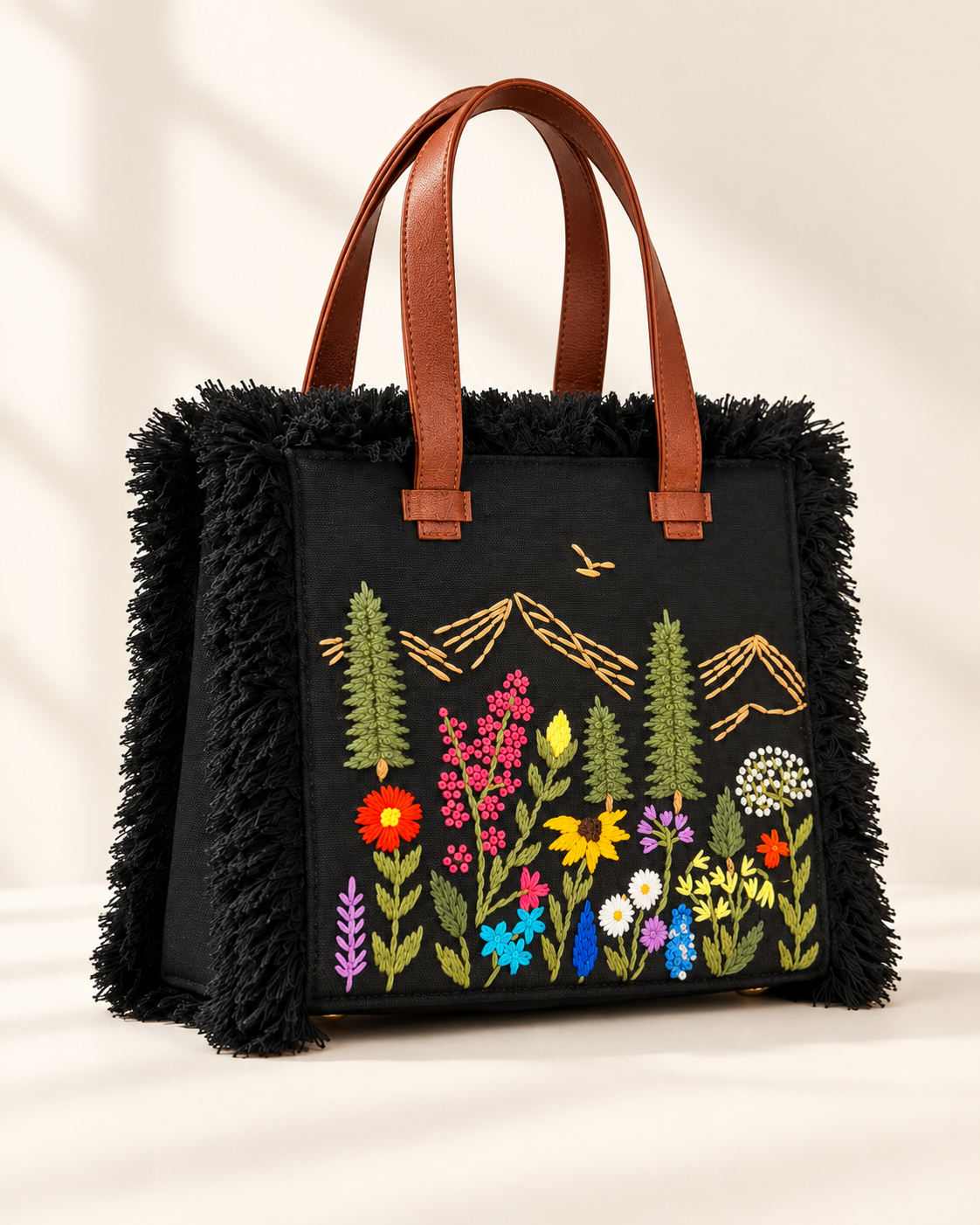 Black Meadow Fringe hand-embroidered handbag, angled view