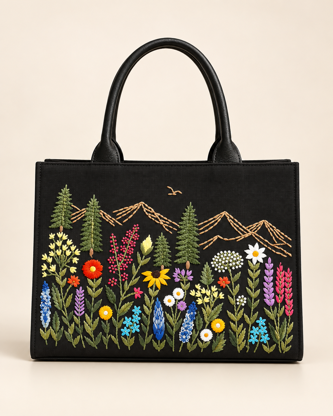 Black · Medium Meadow Carryall handbag with hand-embroidered wildflowers and mountains, front view